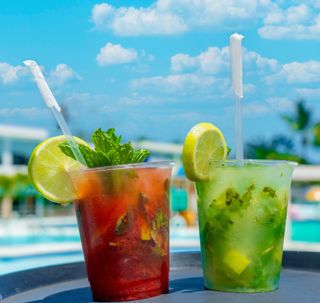 two drinks in plastic cups with straws