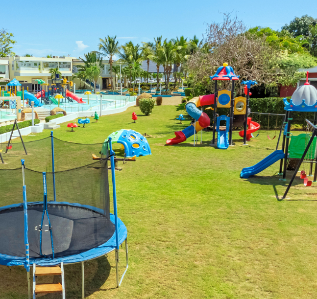 a playground with a trampoline and playground equipment