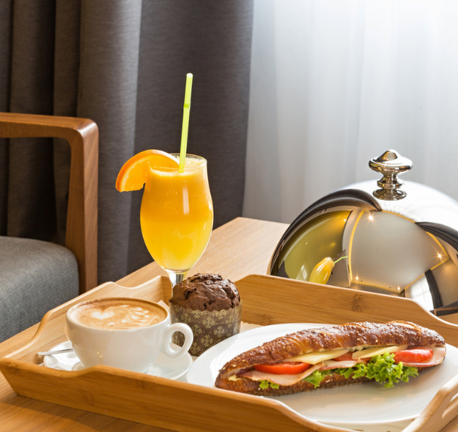 a tray of food and drink on a table