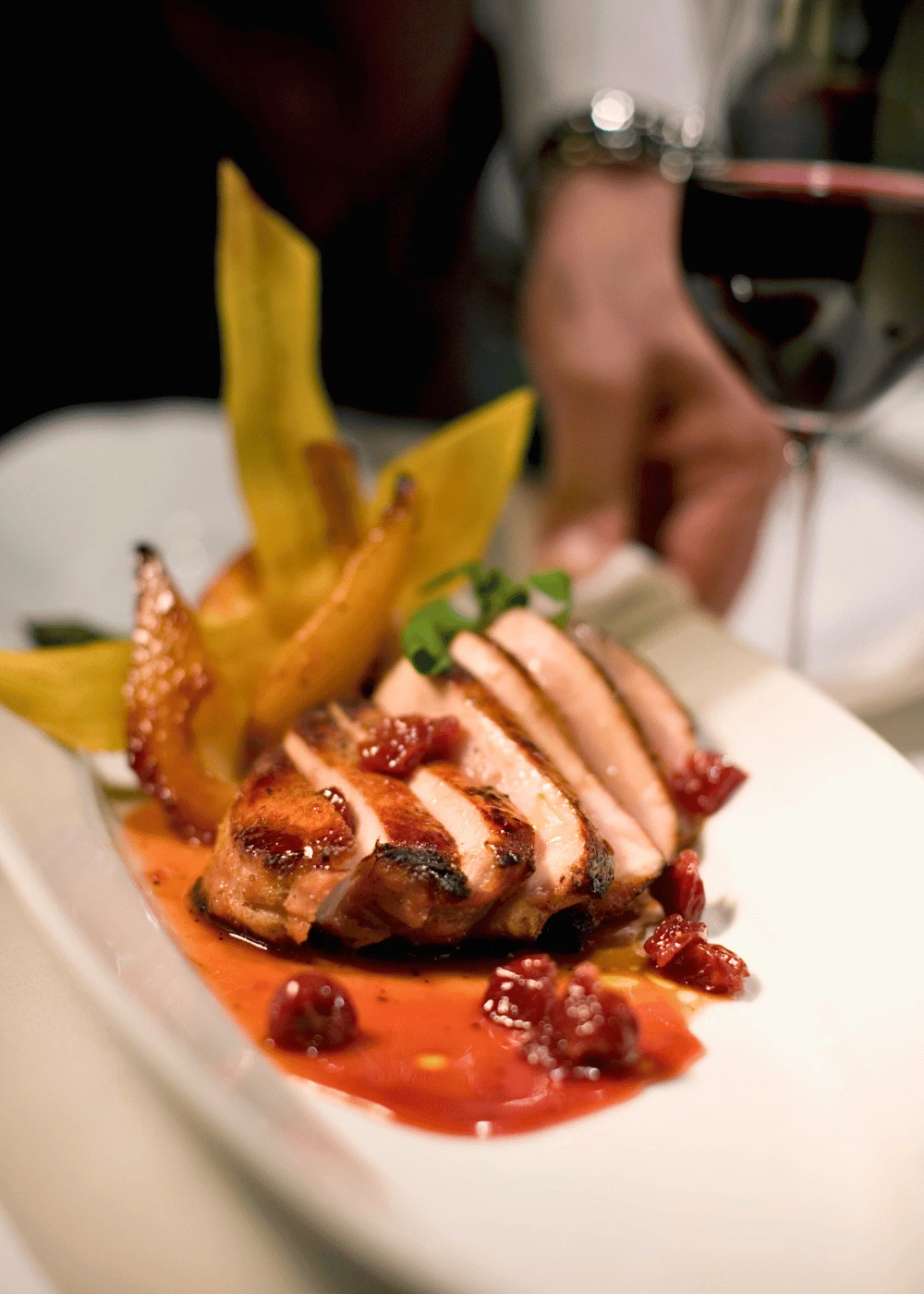 a plate of food with a glass of wine