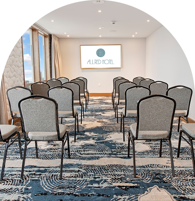 a room with chairs and a sign