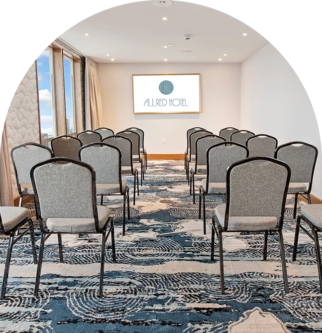 a room with chairs and a sign