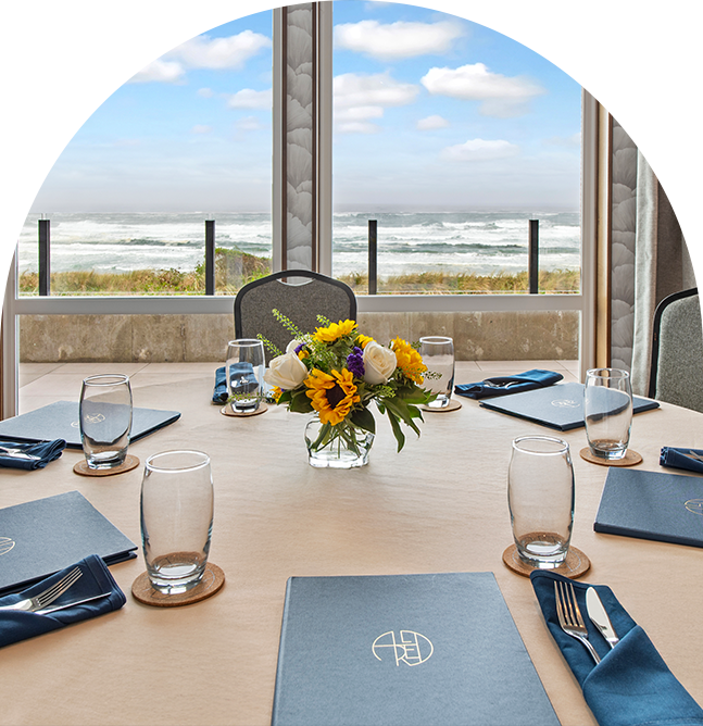 a table with flowers and glasses on it