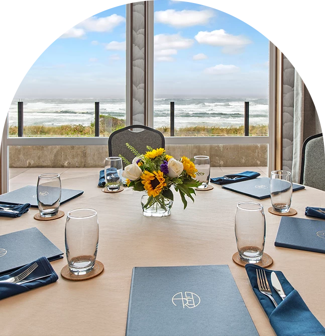 a table with flowers and glasses on it