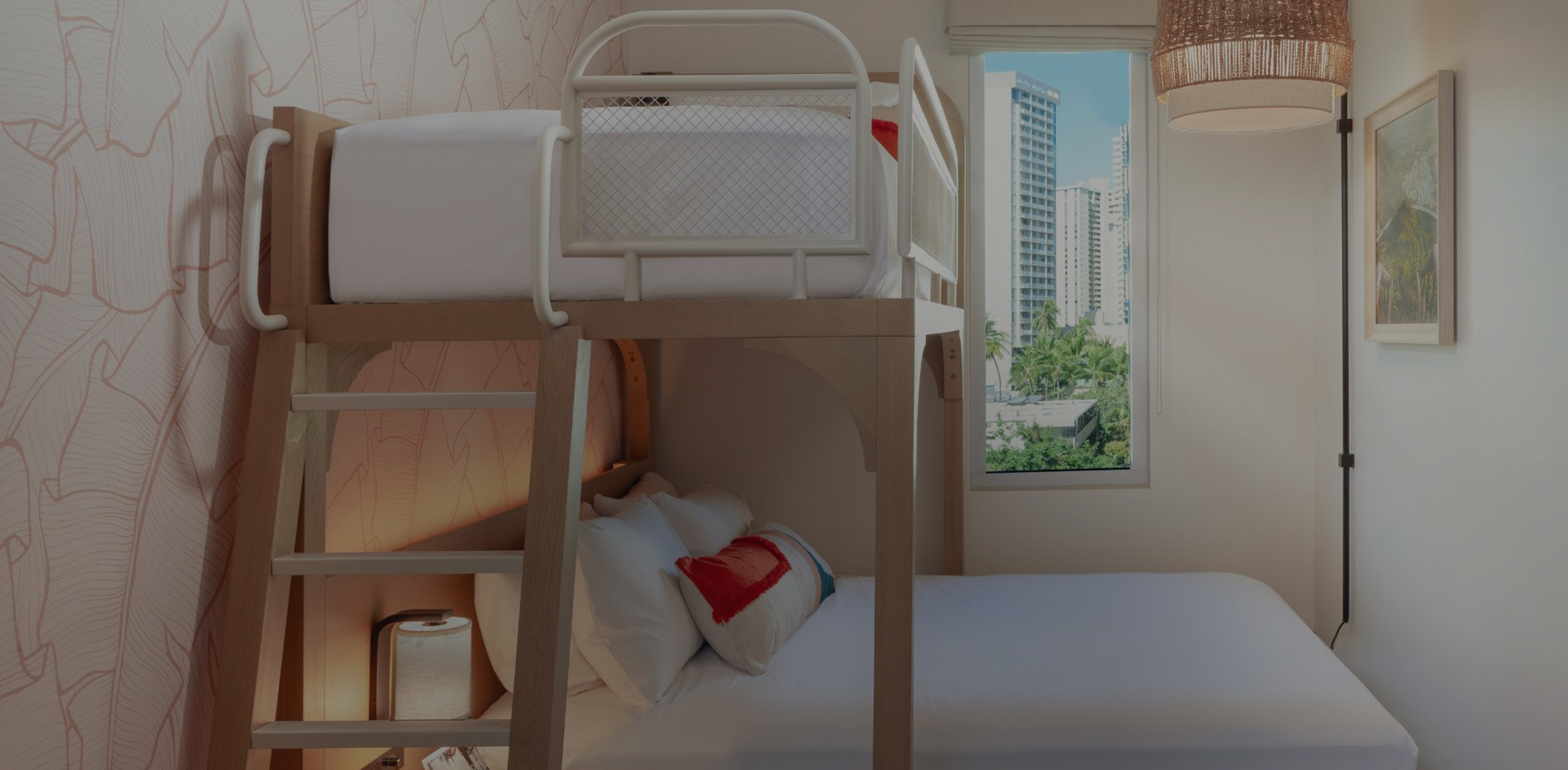 a bunk bed in a room with a window and city view