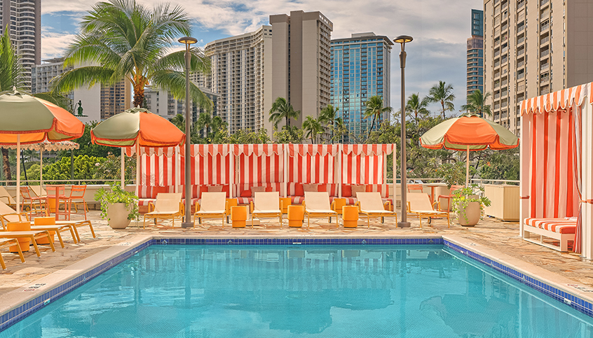 a pool with umbrellas and chairs