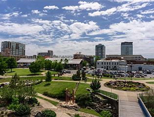 a park with a playground and buildings in the background