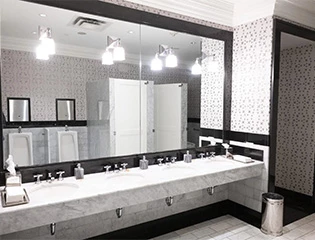 a bathroom with a large mirror