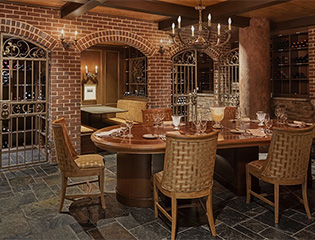 a dining room with a table and chairs