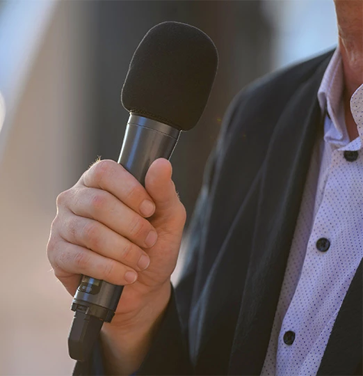 a person holding a microphone