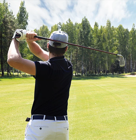 a man holding a golf club