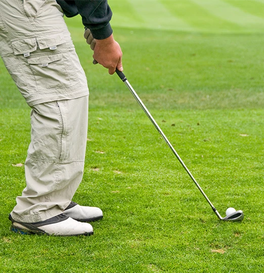 a person holding a golf club