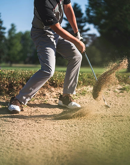 a person holding a golf club