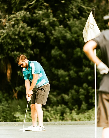 a man playing golf on a golf course