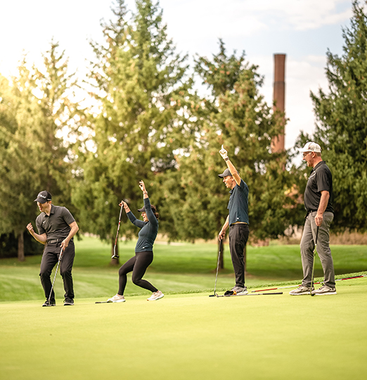 a group of people on a golf course