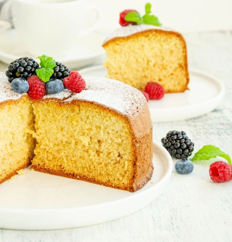 a cake with berries on top of it