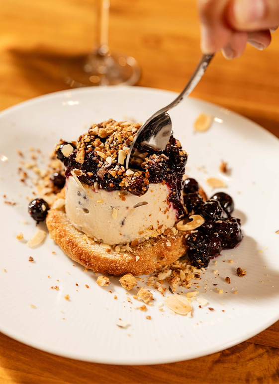 a spoon over a dessert