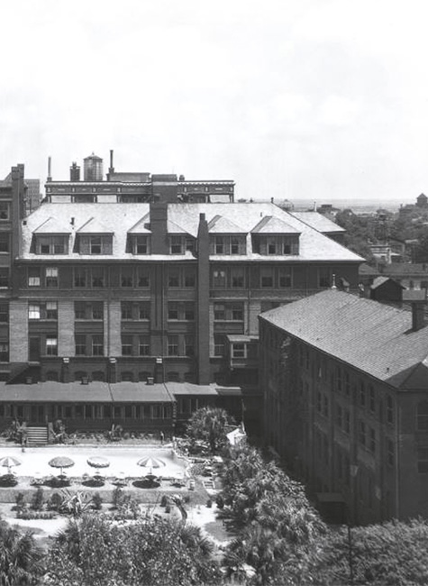 a large building with a pool in the middle