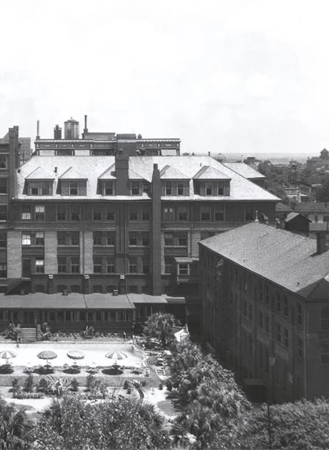 a large building with a pool in the middle