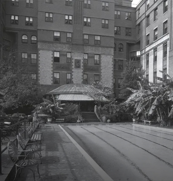 a pool in front of a building