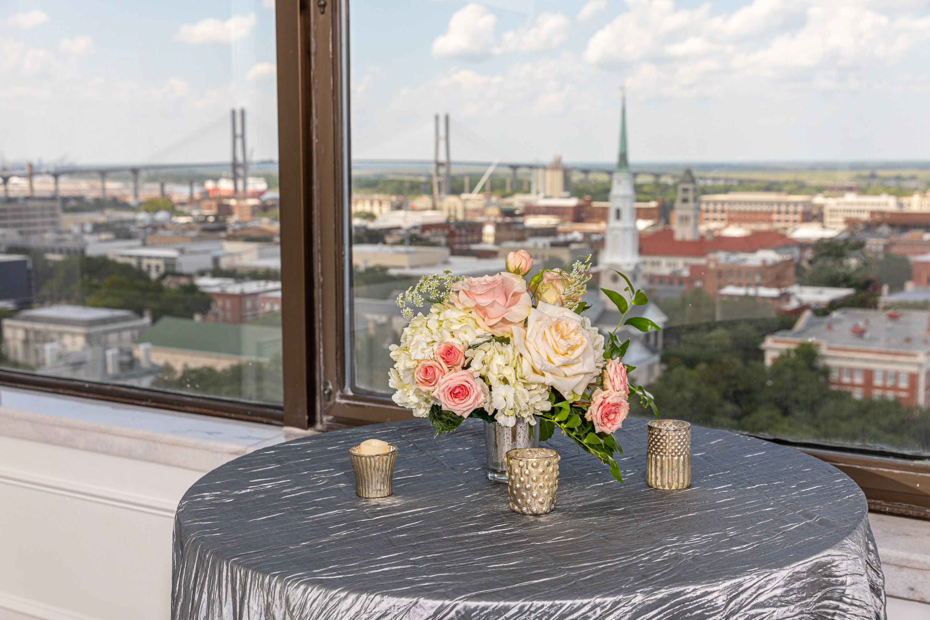 a table with flowers and candles on it