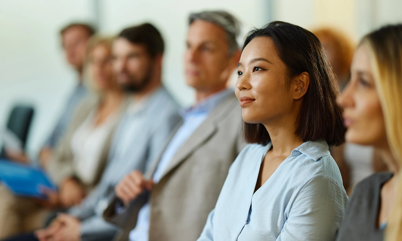 a woman sitting in a row