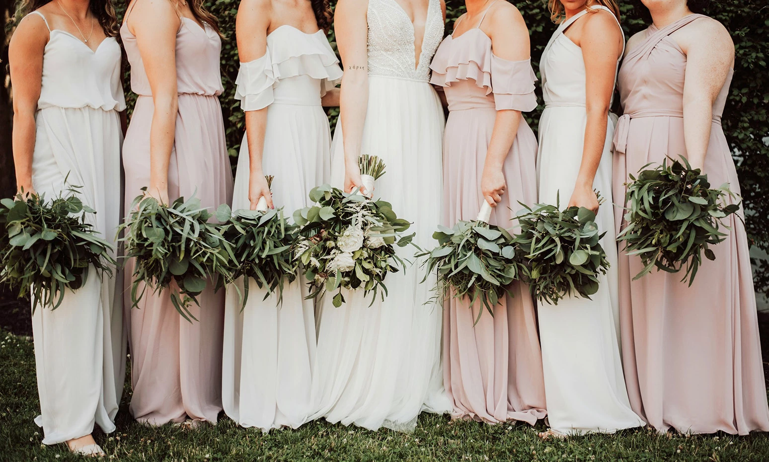 a group of women in dresses