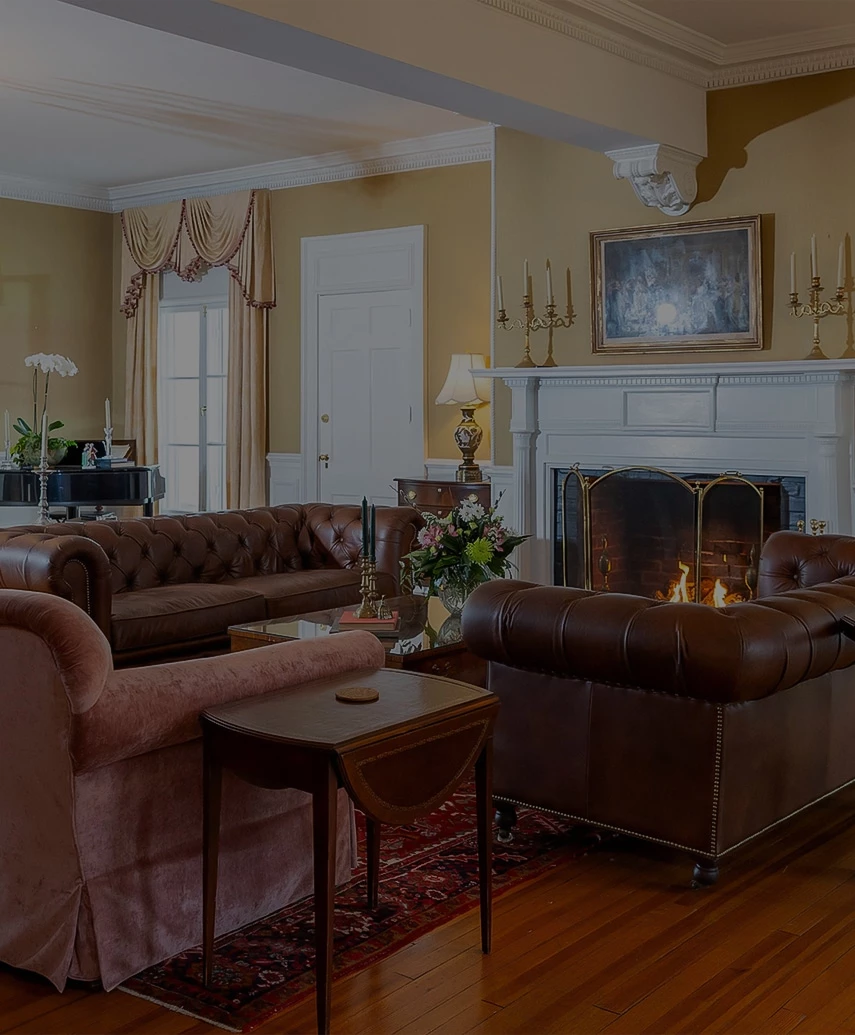 a living room with couches and a fireplace
