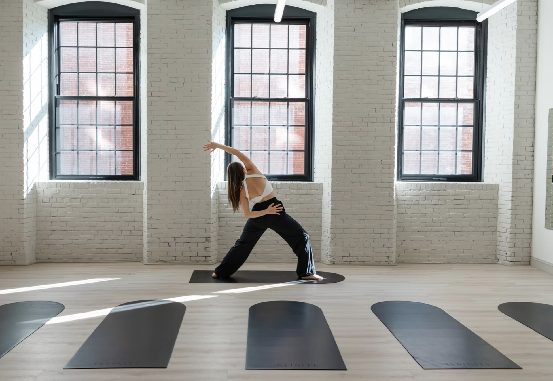 a woman stretching in a room