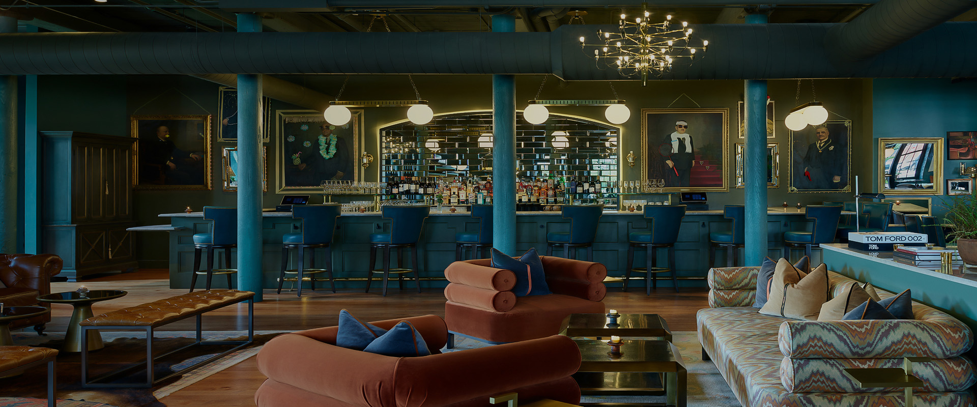 a room with a bar and chairs