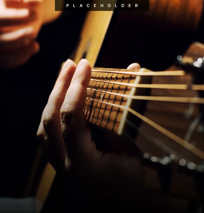 a person playing a guitar