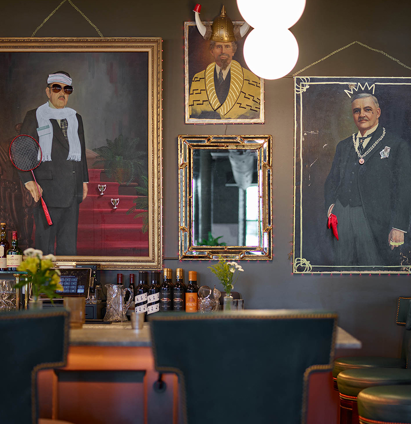 a room with a bar and a table with a chair and a table with chairs and a table with a chair and a table with a chair and a table with chairs and a table with chairs and