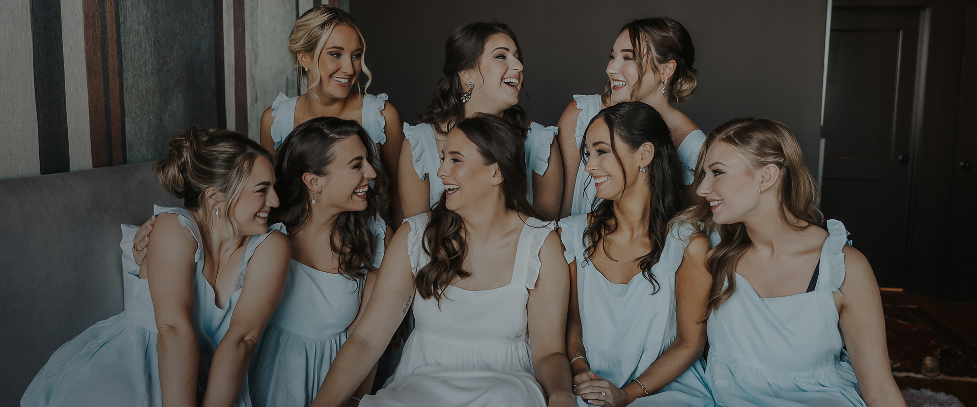a group of women in white dresses