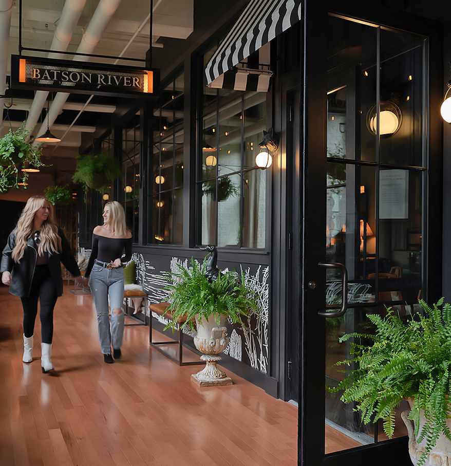 two women walking down a walkway