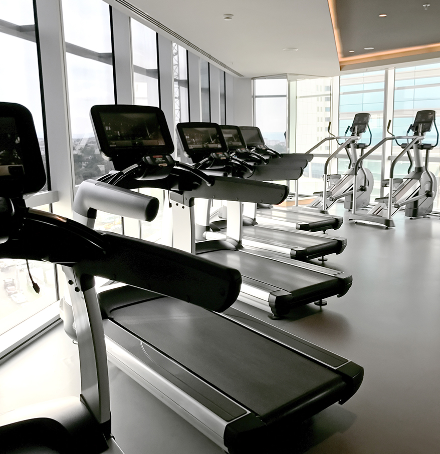 a room with treadmills and exercise machines