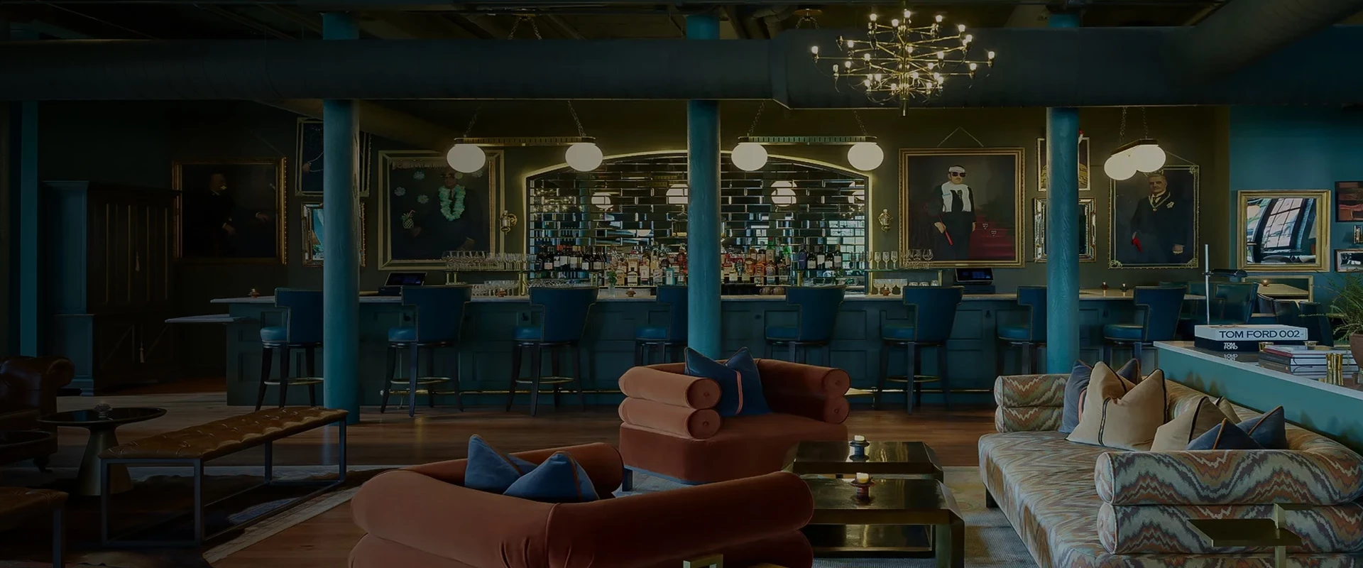 a room with a bar and chairs