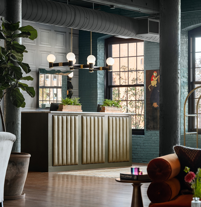 a room with a reception desk and a couch