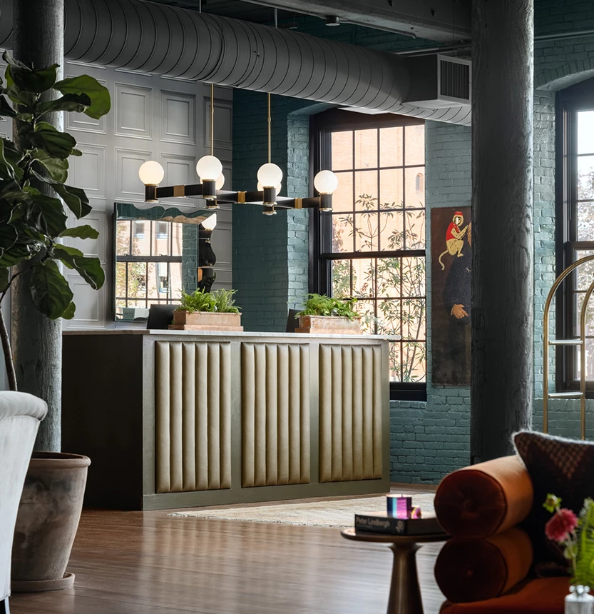a room with a reception desk and a couch