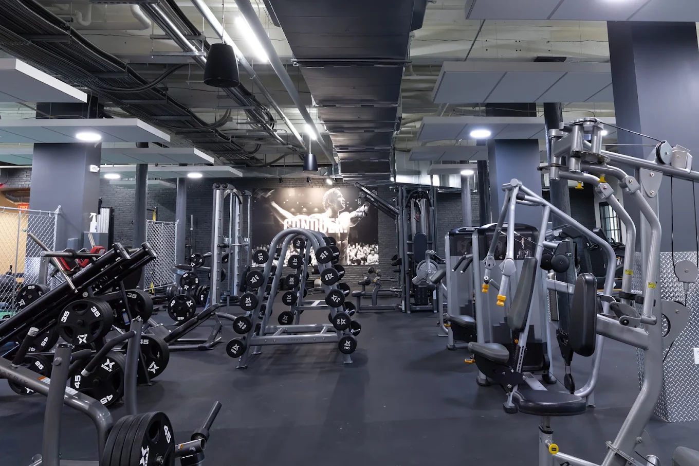 a gym with many exercise equipment