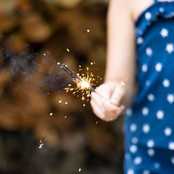 a person holding a sparkler