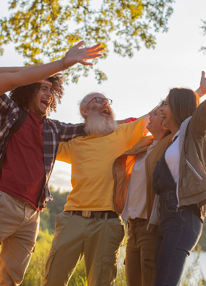 a group of people with arms outstretched