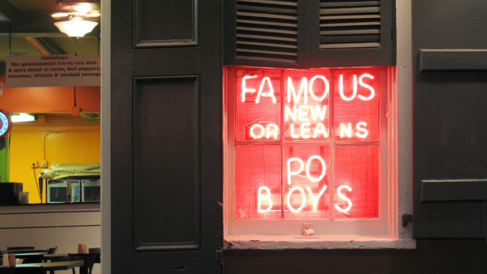 a red neon sign in a window