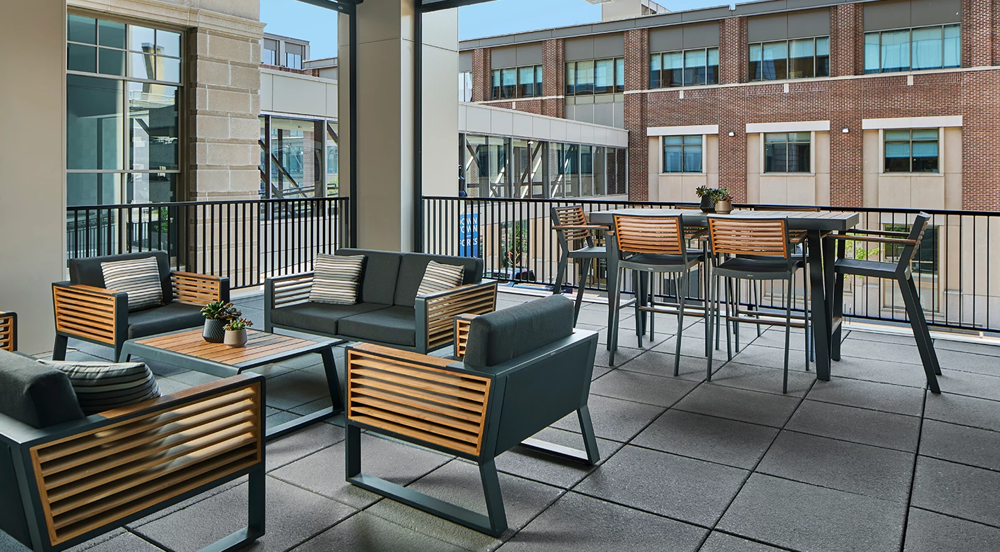 a patio with chairs and tables