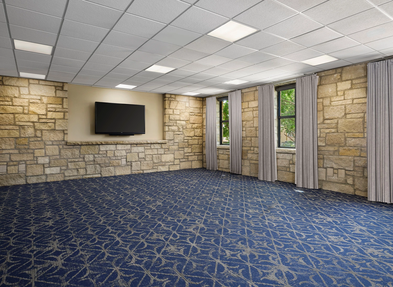 a room with a television on the wall