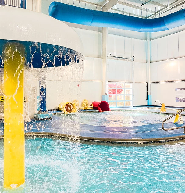 a swimming pool with a large water slide
