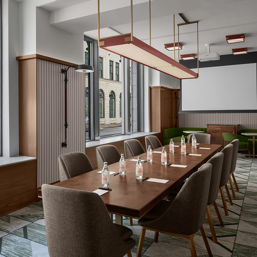 a conference room with a table and chairs