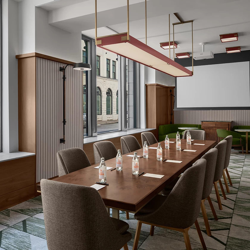 a conference room with a table and chairs