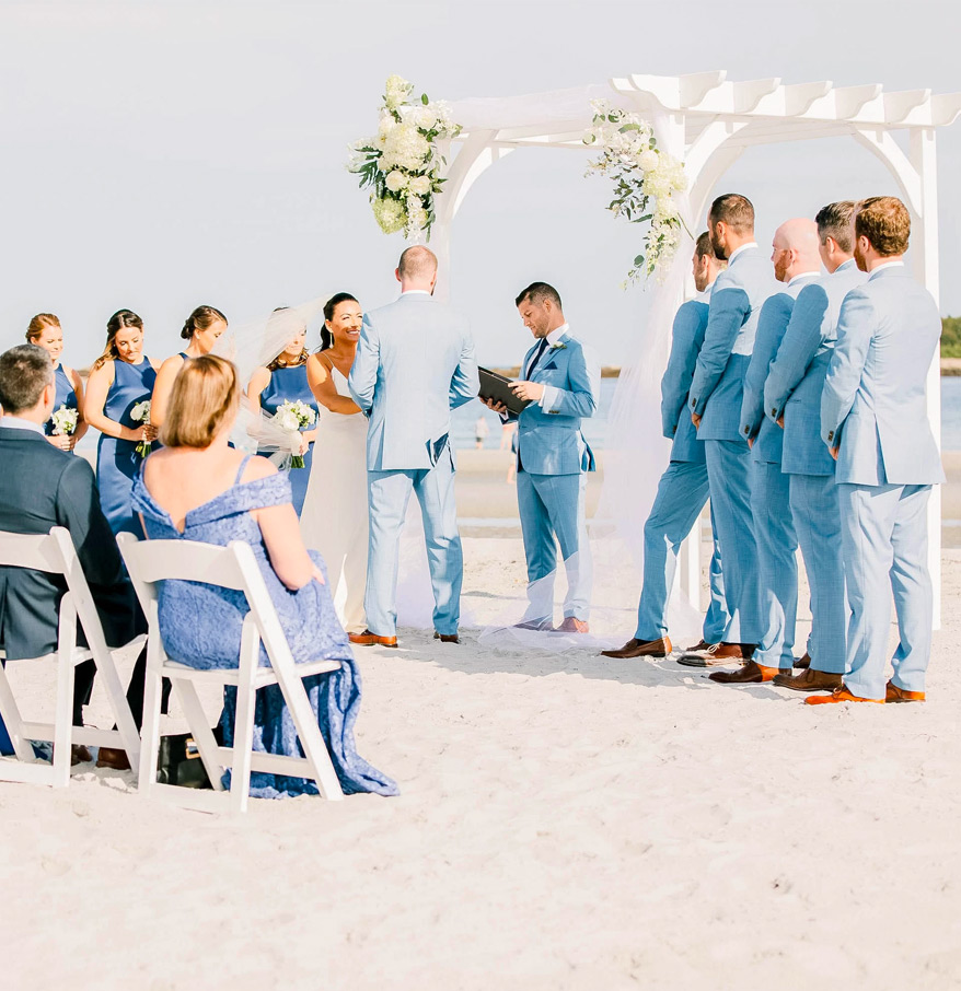 a group of people in white