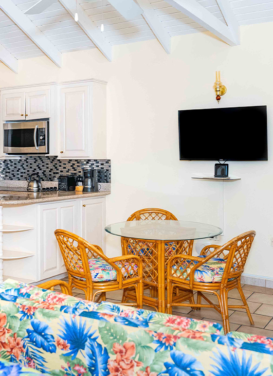 a kitchen with a television and a table