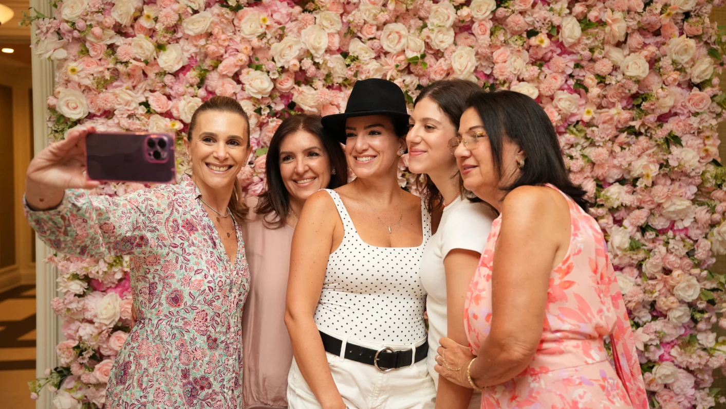 a group of women posing for a photo